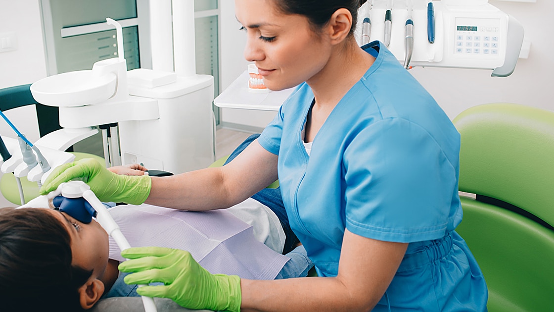 Child Receiving Baby Root Canal Procedure