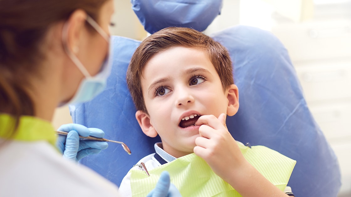 Boy in Dental Chair with Worried Look