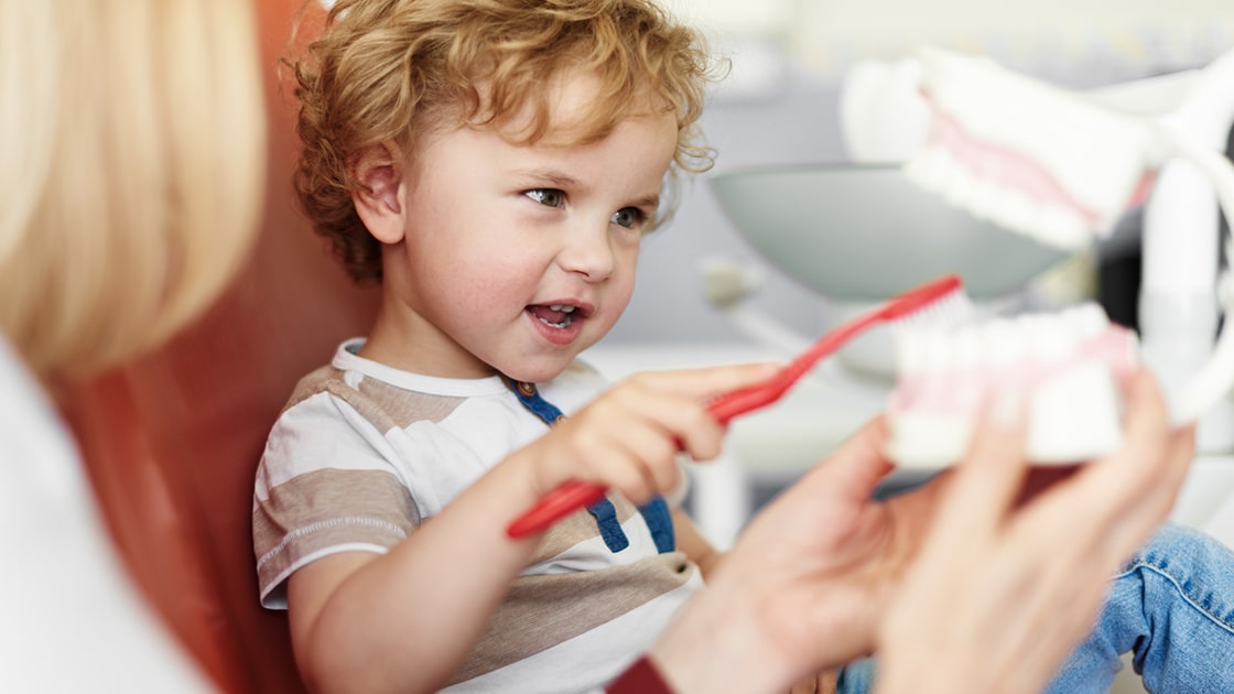 Child Learning Proper Brushing Techniques
