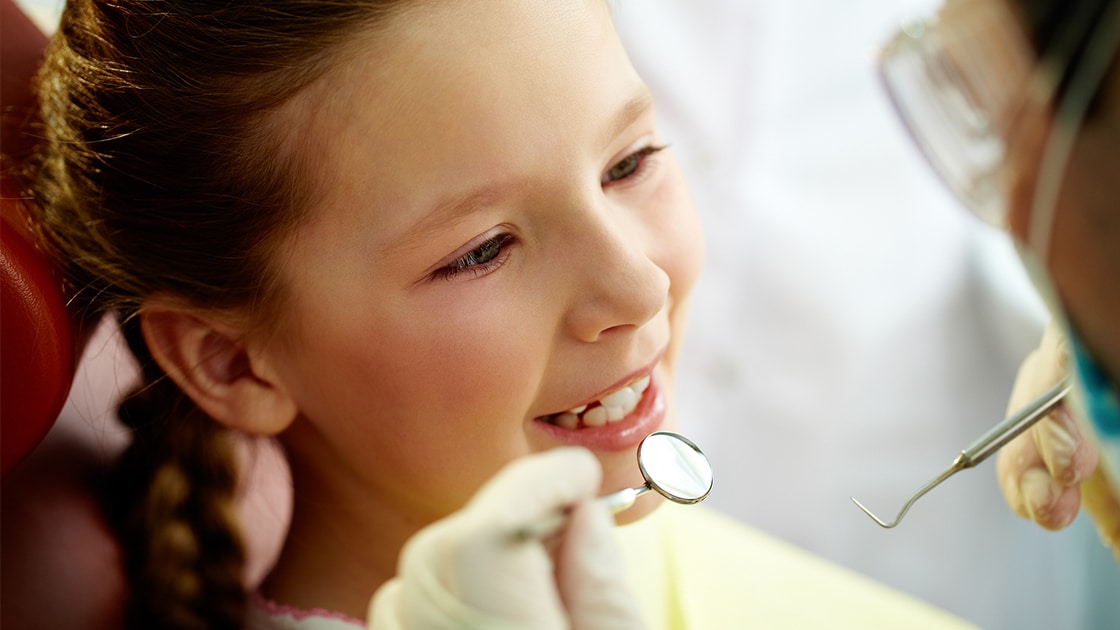 Girl in Dental Chair Getting a Filling