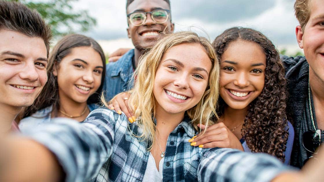 Teens smiling in a selfie